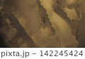Abstract Grainy Bronze and Gold Marble Texture Background with Fluid Waves 142245424
