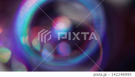 Bokeh light. Colorful glitter texture. Vibrant pink blue green lens flare bright optical glisten reflection on abstract illuminated background. Bokeh light. Colorful glitter texture. Vibrant pink blue green lens flare bright optical glisten reflection on abstract illuminated background. 142246995
