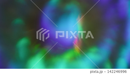 Defocused rainbow texture. Bright glow abstraction. Purple pink blue colorful round optical gleam on luminous bokeh glisten background. 142246996