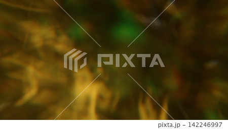 Blur bright glare. Glimmer art. Yellow orange green colorful lens flare shiny gleam kaleidoscope on light abstract bokeh background. Blur bright glare. Glimmer art. Yellow orange green colorful lens flare shiny gleam kaleidoscope on light abstract bokeh background. 142246997