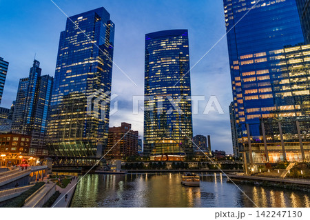 Chicago city cityscape. Cityscape night with skyscraper building. Skyline architecture. Chicago city illuminated building. Night Chicago city downtown. Skyscraper architecture. Skyscrapers at night Chicago city cityscape. Cityscape night with skyscraper building. Skyline architecture. Chicago city illuminated building. Night Chicago city downtown. Skyscraper architecture. Skyscrapers at night 142247130