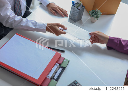Worker Handing White Envelope of Resignation Letter to Manager in Office. 142248423