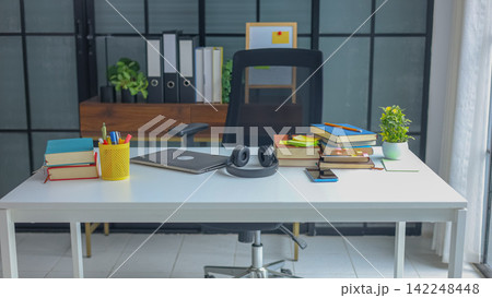 Table of Academic Research and E-Learning Concept with Stacked Books. 142248448