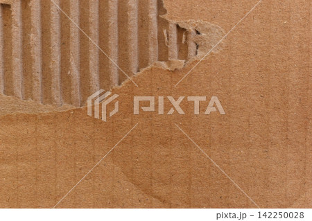 tear brown cardboard box texture background, recycle material 142250028