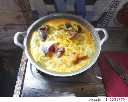 Traditional Indonesian Fish Curry Cooking in Pot Traditional Indonesian Fish Curry Cooking in Pot 142251879