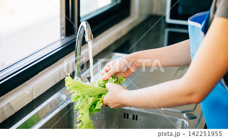 Bright clean vegetables being washed Bright clean vegetables being washed 142251955