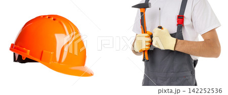 Young man holds tools in his hands with hard hat nearby, PNG 142252536