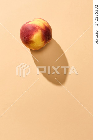 fresh ripe peach fruit on orange background fresh ripe peach fruit on orange background 142255332