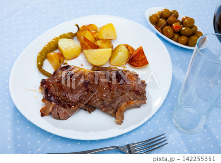 Grilled beef steak with potatoes and jalapenos peppers Grilled beef steak with potatoes and jalapenos peppers 142255351