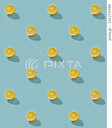 Fresh Half Lemons Pattern on Sunny Blue Background 142255499