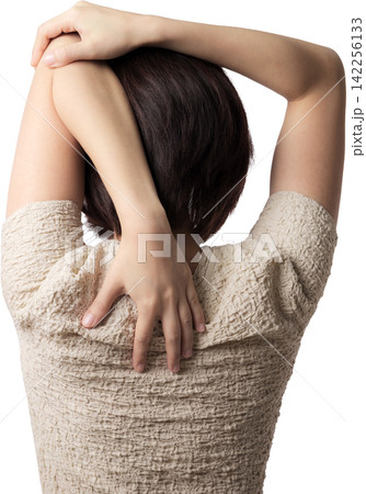 Calm asian woman stretching arm and shoulder back for body pain relief enjoying peaceful healthy exercise posture with relaxed emotion 142256133