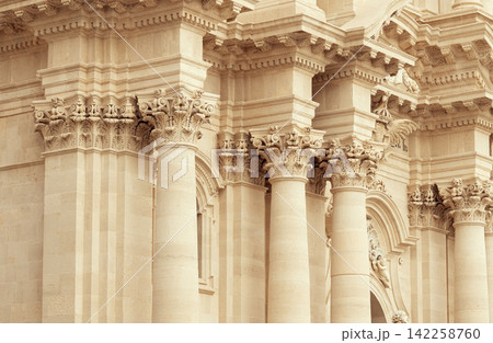 Majestic ancient Greek temple colonnade with intricate Corinthian capitals and ornate frieze 142258760