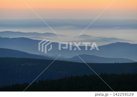 Beautiful landscape and sunset in the mountains. Hills in clouds. Jeseniky - Czech Republic - Europe. 142259129