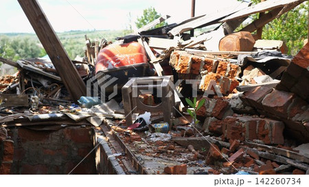 View to destroyed residential buildings at Kharkivska oblast. Ruined houses after bomb attacks on ukrainian territory from russia army. Consequences of russian invasion of Ukraine. Slow motion 142260734