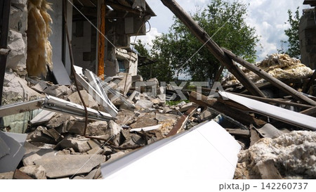 View to destroyed residential buildings at Kharkivska oblast. Ruined houses after bomb attacks on ukrainian territory from russia army. Consequences of russian invasion of Ukraine. Slow motion 142260737
