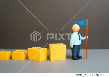 A businessman leads a chain of boxes with goods. Entering new markets and pioneering a product. Business expansion creates new trade routes and growth opportunities. A businessman leads a chain of boxes with goods. Entering new markets and pioneering a product. Business expansion creates new trade routes and growth opportunities. 142263532