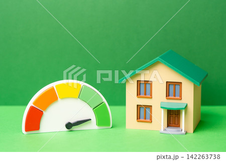 House and energy efficiency scale showing a good result. High autonomy, sustainability and cost efficiency of housing. Lower utility costs improve property value. House and energy efficiency scale showing a good result. High autonomy, sustainability and cost efficiency of housing. Lower utility costs improve property value. 142263738