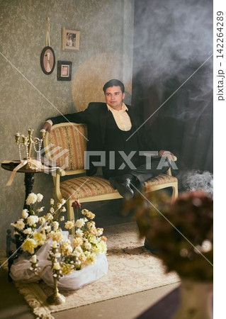 Noir style portrait of cautious detective with smoky ambiance Noir style portrait of cautious detective with smoky ambiance 142264289