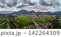 Aerial panorama of Oberstdorf under dramatic evening clouds 142264309