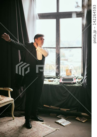 Performer in elegant attire practicing on stage background 142264593