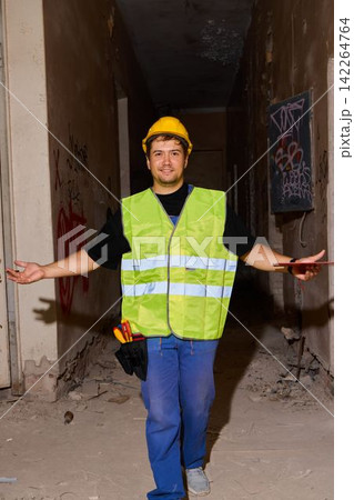 Caucasian site supervisor in reflective vest and helmet Caucasian site supervisor in reflective vest and helmet 142264764