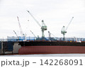 A large ship that is currently undergoing repairs. 142268091