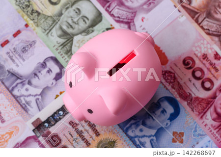 A piggy bank as a concept for storing, accumulating, and saving financial resources A piggy bank as a concept for storing, accumulating, and saving financial resources 142268697