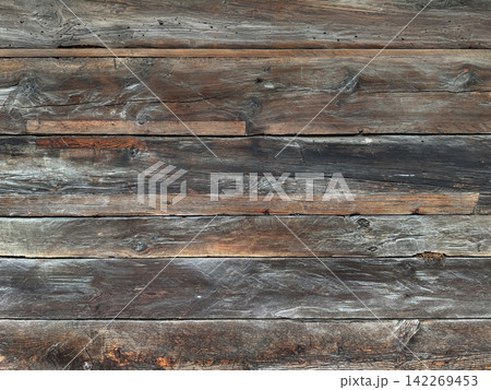 Weathered wood texture from an old wooden house, horizontal background Weathered wood texture from an old wooden house, horizontal background 142269453