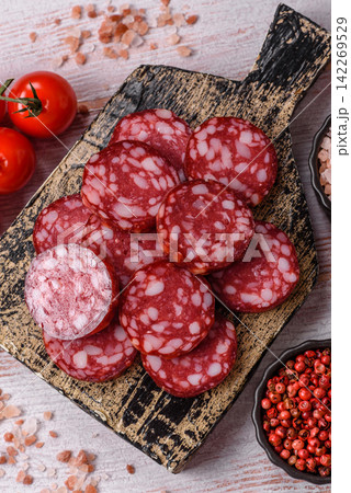 Slices of smoked salami for sandwiches or a lunch spread. Salami slices 142269529