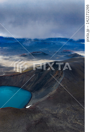 Aerial view of volcanic crater with turquoise geothermal lake, Rangárthing ytra Iceland 142272266