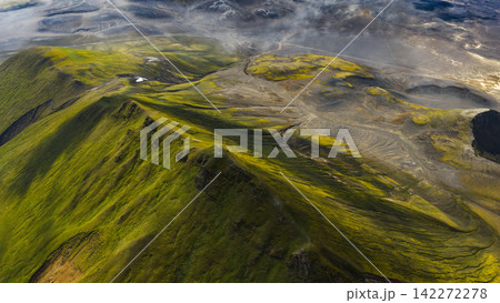 Aerial view of moss-covered volcanic mountains with glacial rivers, Rangárþing ytra Iceland Aerial view of moss-covered volcanic mountains with glacial rivers, Rangárþing ytra Iceland 142272278