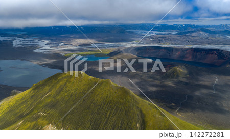 Aerial view of moss-covered volcanic cone and crater lake, Rangárþing ytra Iceland 142272281