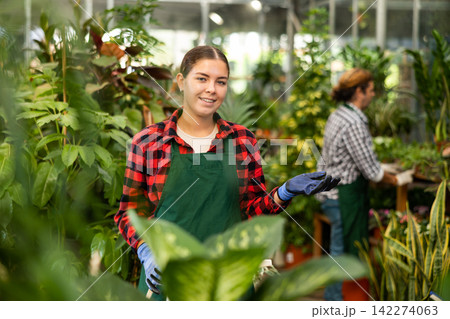 Portrait of a young woman horticulturist Portrait of a young woman horticulturist 142274063