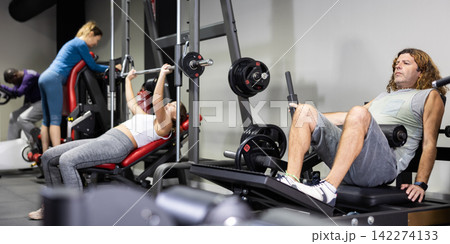 Athletic sporty man doing press at sport gym Athletic sporty man doing press at sport gym 142274133