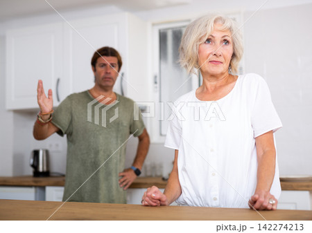 Mature couple quarreling at home, relationship problems Mature couple quarreling at home, relationship problems 142274213
