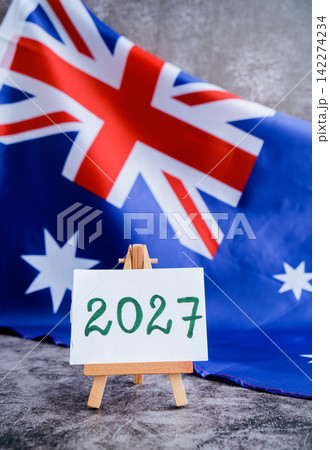 Australian flag and text 2027 trendy template for upcoming year campaigns. Patriotic design marking 2027 beside national flag. Concept of future vision and planning ideal for annual report or goal Australian flag and text 2027 trendy template for upcoming year campaigns. Patriotic design marking 2027 beside national flag. Concept of future vision and planning ideal for annual report or goal 142274234