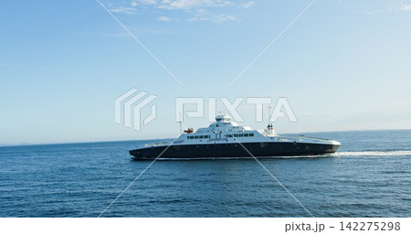 Modern ferry navigating clear blue waters of norway Modern ferry navigating clear blue waters of norway 142275298