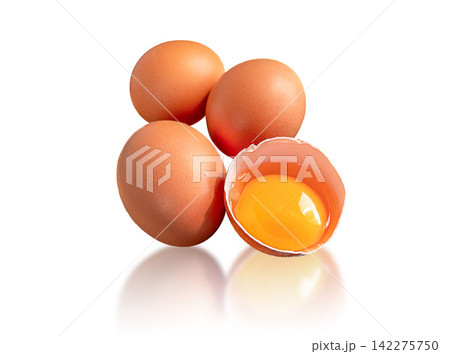 Three whole brown chicken eggs and one cracked eggshell with raw golden yolk isolated on white background. Cooking ingredients for cooking, baking, breakfast, nutrition and healthy homemade meals use. Three whole brown chicken eggs and one cracked eggshell with raw golden yolk isolated on white background. Cooking ingredients for cooking, baking, breakfast, nutrition and healthy homemade meals use. 142275750