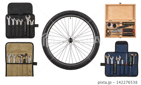 Collapsible tool pouches and wrench kits alongside a large bicycle wheel against a white background with mechanic equipment hardware maintenance workshop organization assortment collection Collapsible tool pouches and wrench kits alongside a large bicycle wheel against a white background with mechanic equipment hardware maintenance workshop organization assortment collection 142276538