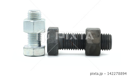 Industrial Galvanized Steel Bolt Beside Large Heavy-Duty Black Oxide Fastener Isolated on White Background Industrial Galvanized Steel Bolt Beside Large Heavy-Duty Black Oxide Fastener Isolated on White Background 142278894