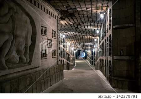 Huge bottle collection stored inside underground wine cellars tunnel Huge bottle collection stored inside underground wine cellars tunnel 142279791