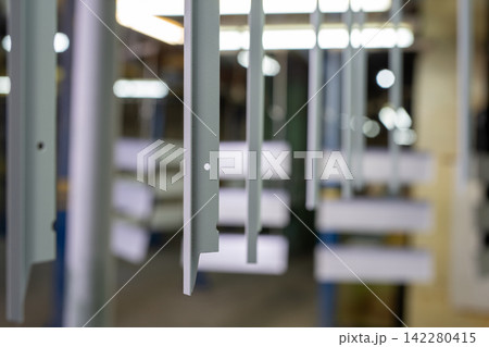 Industrial metal components in factory setting with shallow depth of field Industrial metal components in factory setting with shallow depth of field 142280415