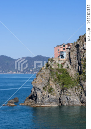 Manarola within the Cinque Terre landscape in Italy from telephoto coastal perspective 142281582