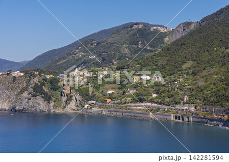 Coastal railway at Cinque Terre, Italy from a long-range coastal viewpoint across the bay Coastal railway at Cinque Terre, Italy from a long-range coastal viewpoint across the bay 142281594