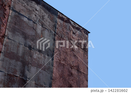Rusted metal with oxidized surface, seams and abstract patina in hard clear daylight Rusted metal with oxidized surface, seams and abstract patina in hard clear daylight 142281602
