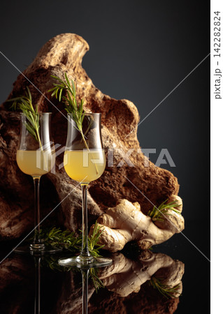 Ginger liquor with a rosemary branch. Ginger liquor with a rosemary branch. 142282824