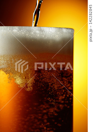 Glass of tasty beer with foam, closeup. Glass of tasty beer with foam, closeup. 142282845