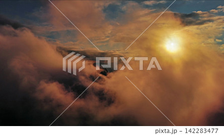Aerial view of orange fluffy cloud in sky Aerial view of orange fluffy cloud in sky 142283477