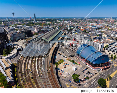 High angle wide horizontal aerial drone photograph of Central Station, Musical Dome, railway tracks, Colonius TV tower, and city skyline in Cologne, North Rhine-Westphalia, Germany, Central Europe High angle wide horizontal aerial drone photograph of Central Station, Musical Dome, railway tracks, Colonius TV tower, and city skyline in Cologne, North Rhine-Westphalia, Germany, Central Europe 142284510