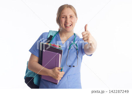 Confident Nursing Student with Books and Pen 142287249